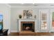 Charming brick fireplace with decorative mantel, perfect for cozy evenings by the fire at 6750 Olde Province Ct, Raleigh, NC 27609