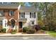 Charming townhouse with brick and siding exterior and manicured front yard at 6750 Olde Province Ct, Raleigh, NC 27609