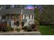 Charming townhouse with brick and siding exterior and manicured front yard at dusk at 6750 Olde Province Ct, Raleigh, NC 27609