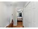 Hallway with hardwood floors leading to the bedroom at 6750 Olde Province Ct, Raleigh, NC 27609