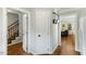 Hallway view showing staircase, living room, and kitchen at 6750 Olde Province Ct, Raleigh, NC 27609
