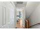 Hallway with hardwood flooring leading to bedroom at 6750 Olde Province Ct, Raleigh, NC 27609