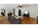Cozy living area featuring hardwood floors, an entertainment center, and comfortable seating for a relaxing atmosphere at 6750 Olde Province Ct, Raleigh, NC 27609