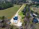 Spacious property featuring a modern house, in-ground pool, and sprawling green land surrounded by trees and marked property lines at 73 Clyde Pearce Rd, Zebulon, NC 27597
