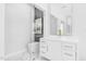 Stylish bathroom with glass shower, sliding door and sink with vanity and marble floors at 73 Clyde Pearce Rd, Zebulon, NC 27597