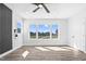 Bedroom featuring a ceiling fan, hard wood floors, and large windows at 73 Clyde Pearce Rd, Zebulon, NC 27597