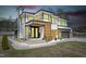 Modern two-story home with stylish black framed windows and a welcoming entryway at 73 Clyde Pearce Rd, Zebulon, NC 27597
