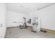 Clean garage space featuring laundry hookups and exercise equipment at 73 Clyde Pearce Rd, Zebulon, NC 27597