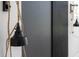 Stylish interior shot showcasing a modern black wall lamp with a unique rope cord design at 73 Clyde Pearce Rd, Zebulon, NC 27597