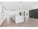 Bright and airy kitchen with white cabinets, quartz countertops, and a large island at 73 Clyde Pearce Rd, Zebulon, NC 27597
