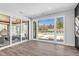 Bright living room boasting hardwood floors and a view of the community pool and outdoor entertainment area at 73 Clyde Pearce Rd, Zebulon, NC 27597