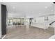 Open-concept living room boasts hardwood floors, modern fireplace, and a bright kitchen at 73 Clyde Pearce Rd, Zebulon, NC 27597