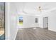 Well lit main bedroom with ceiling fan, large windows, and an ensuite bathroom at 73 Clyde Pearce Rd, Zebulon, NC 27597