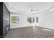 Spacious main bedroom features large windows and a ceiling fan in a modern new home at 73 Clyde Pearce Rd, Zebulon, NC 27597