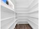 Walk-in pantry with custom shelving for optimal storage and organization at 73 Clyde Pearce Rd, Zebulon, NC 27597