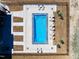 Aerial view of a community pool with lounge chairs and a fully fenced area at 73 Clyde Pearce Rd, Zebulon, NC 27597
