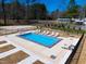 Community pool with lounge chairs, fully fenced for privacy at 73 Clyde Pearce Rd, Zebulon, NC 27597