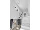 A modern staircase with marble steps and glass railings leading to the upper level at 73 Clyde Pearce Rd, Zebulon, NC 27597