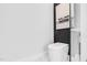 Modern bathroom featuring a sleek, elongated toilet and stylish decor at 73 Clyde Pearce Rd, Zebulon, NC 27597