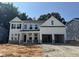 New two-story home featuring a two car garage, covered porch, and craftsman style architectural details at 740 Portland Rose Dr, Knightdale, NC 27545