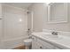 Clean bathroom with a tub and shower combination, vanity, sink, and mirror at 815 Riverbark Ln, Durham, NC 27703