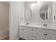 Bright bathroom with double sinks, modern fixtures, white cabinets, and a shower/tub combination at 815 Riverbark Ln, Durham, NC 27703