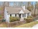 Beautiful single Gathering home with neutral siding, black shutters, and manicured landscaping at 815 Riverbark Ln, Durham, NC 27703