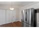 This kitchen features stainless steel appliances and is adjacent to additional storage at 815 Riverbark Ln, Durham, NC 27703