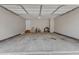 Spacious two car garage with neutral paint, concrete flooring and good ceiling height and storage at 9512 Anson Grove Ln, Raleigh, NC 27615