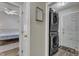Convenient laundry area with stacked washer and dryer, located just off the main bedroom at 9512 Anson Grove Ln, Raleigh, NC 27615