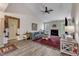 Bright living room boasts wood floors, modern furnishings, and stylish decor at 9512 Anson Grove Ln, Raleigh, NC 27615