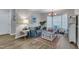 Comfortable sitting area with natural light, wood flooring, stylish furnishings and charming details at 9512 Anson Grove Ln, Raleigh, NC 27615