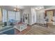 Inviting living room featuring hardwood floors, a cozy seating area, and ample natural light at 9512 Anson Grove Ln, Raleigh, NC 27615