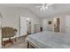 A bright main bedroom features a vaulted ceiling, ceiling fan, and multiple closets for storage at 9512 Anson Grove Ln, Raleigh, NC 27615