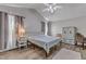 Spacious main bedroom with vaulted ceiling, ceiling fan, and a large window for natural light at 9512 Anson Grove Ln, Raleigh, NC 27615