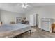 Bright main bedroom features vaulted ceiling, neutral decor, and ensuite bathroom at 9512 Anson Grove Ln, Raleigh, NC 27615