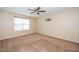 Bedroom featuring neutral walls, carpet, ceiling fan, and a window providing natural light at 1 Serenity Ct, Durham, NC 27704