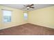 Bright bedroom with two windows and ceiling fan at 1 Serenity Ct, Durham, NC 27704