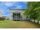 Back exterior elevation showing backyard and screened porch at 1 Serenity Ct, Durham, NC 27704