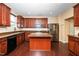 Well-lit kitchen featuring stainless steel appliances, ample cabinetry, and a center island at 1 Serenity Ct, Durham, NC 27704