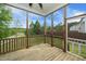 Screened porch with ceiling fan overlooking backyard at 1 Serenity Ct, Durham, NC 27704