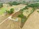 Scenic aerial view of a house surrounded by fields and scattered trees at 10 Chaney Ln, Louisburg, NC 27549
