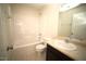 Bright bathroom featuring a shower-tub combo, neutral walls, and a single sink vanity at 10 Chaney Ln, Louisburg, NC 27549