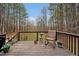 Back porch features a wooden deck and furniture to relax on at 100 Hillside Village Dr, Louisburg, NC 27549