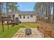 The backyard features a fire pit and stone patio at 100 Hillside Village Dr, Louisburg, NC 27549