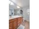 Bathroom with double sink vanity, and large mirror, creating a spacious atmosphere at 100 Hillside Village Dr, Louisburg, NC 27549