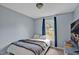 Comfortable bedroom with carpet, neutral walls and natural light from the window at 100 Hillside Village Dr, Louisburg, NC 27549
