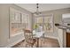 Charming breakfast nook with two windows, bright natural light and sleek flooring at 100 Hillside Village Dr, Louisburg, NC 27549