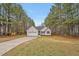 Charming single story home has an attached 2 car garage and manicured lawn at 100 Hillside Village Dr, Louisburg, NC 27549
