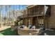 A multi-level backyard with a deck, patio, and cozy fire pit perfect for outdoor entertaining at 1009 High Trail Ct, Wake Forest, NC 27587